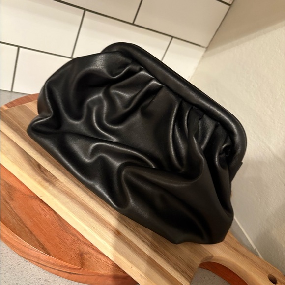 Black Clutch with Gold Chain Handle and Soft Texture - Picture 2 of 3